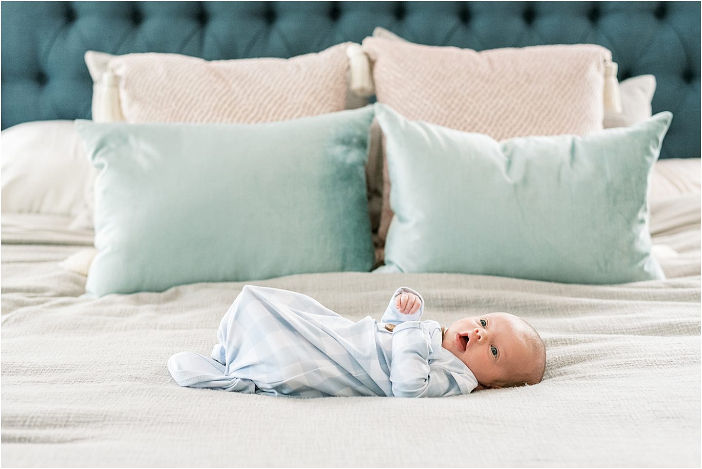 Baby boy laying in bed for in-home lifestyle newborn session with Carmel Photographer, Lindsay Konopa Photography.