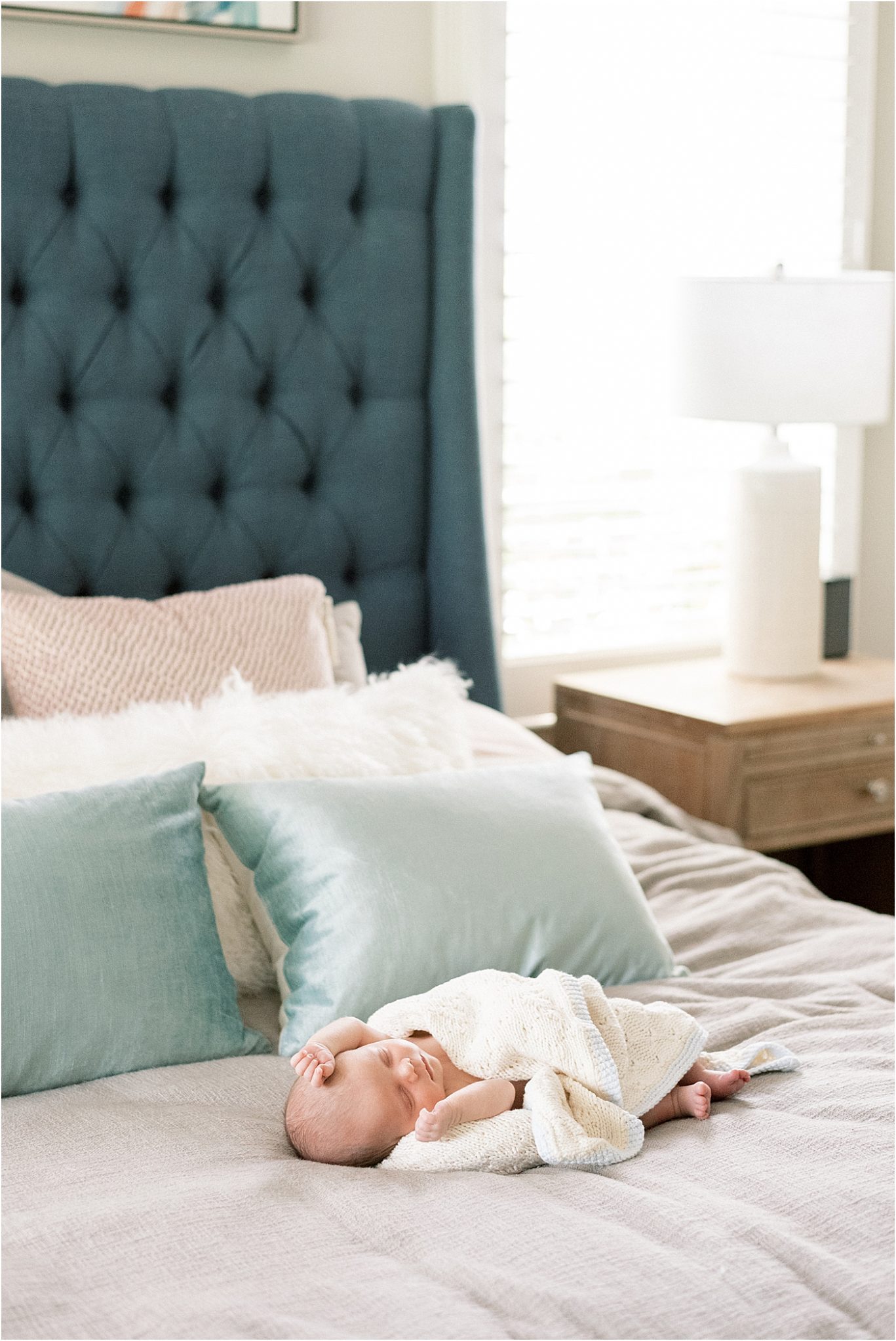 Baby boy sleeping on bed. Photo by Carmel, Indiana Lifestyle Newborn Photographer, Lindsay Konopa Photography.