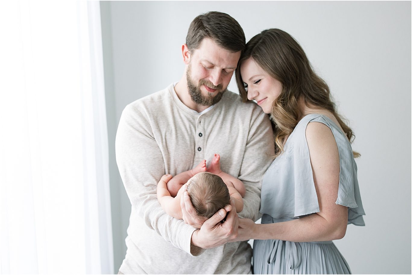 Family portrait during newborn session in studio in Fishers. Photo by Lindsay Konopa Photography.