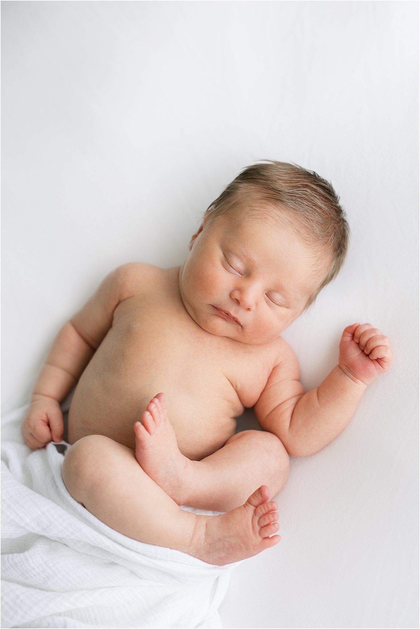 Baby boy sleeping during newborn session. Photo by Lindsay Konopa Photography.