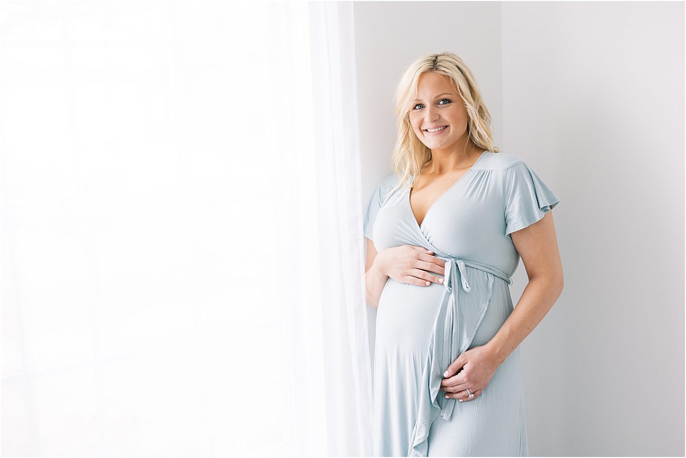 Woman in blue maternity dress.