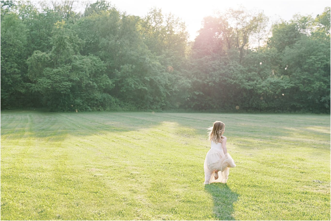 Little girl running through field at sunset. Photo by Carmel Family Photographer, Lindsay Konopa Photography.