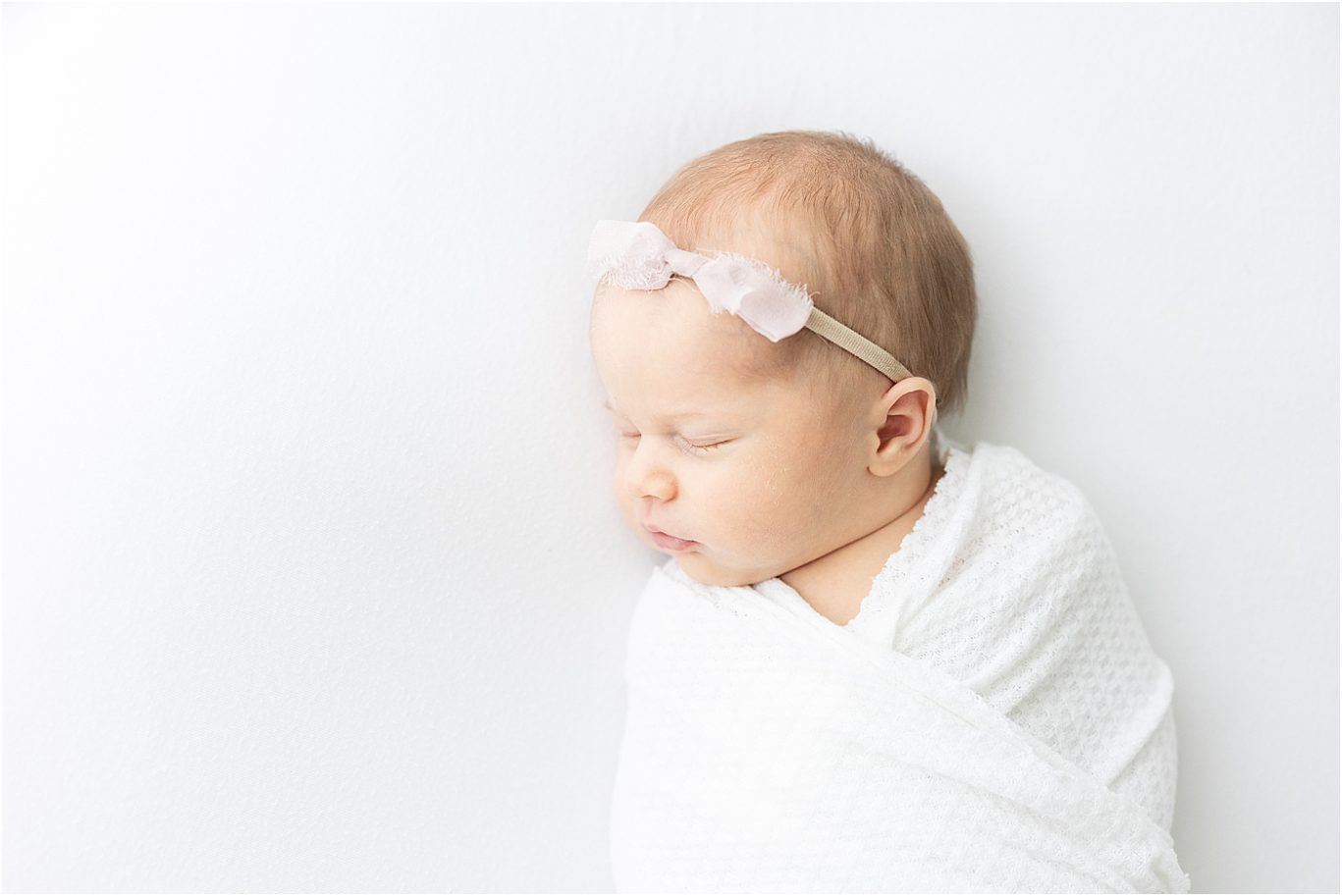 Newborn session with baby girl in studio in Fishers. Photo by Lindsay Konopa Photography.