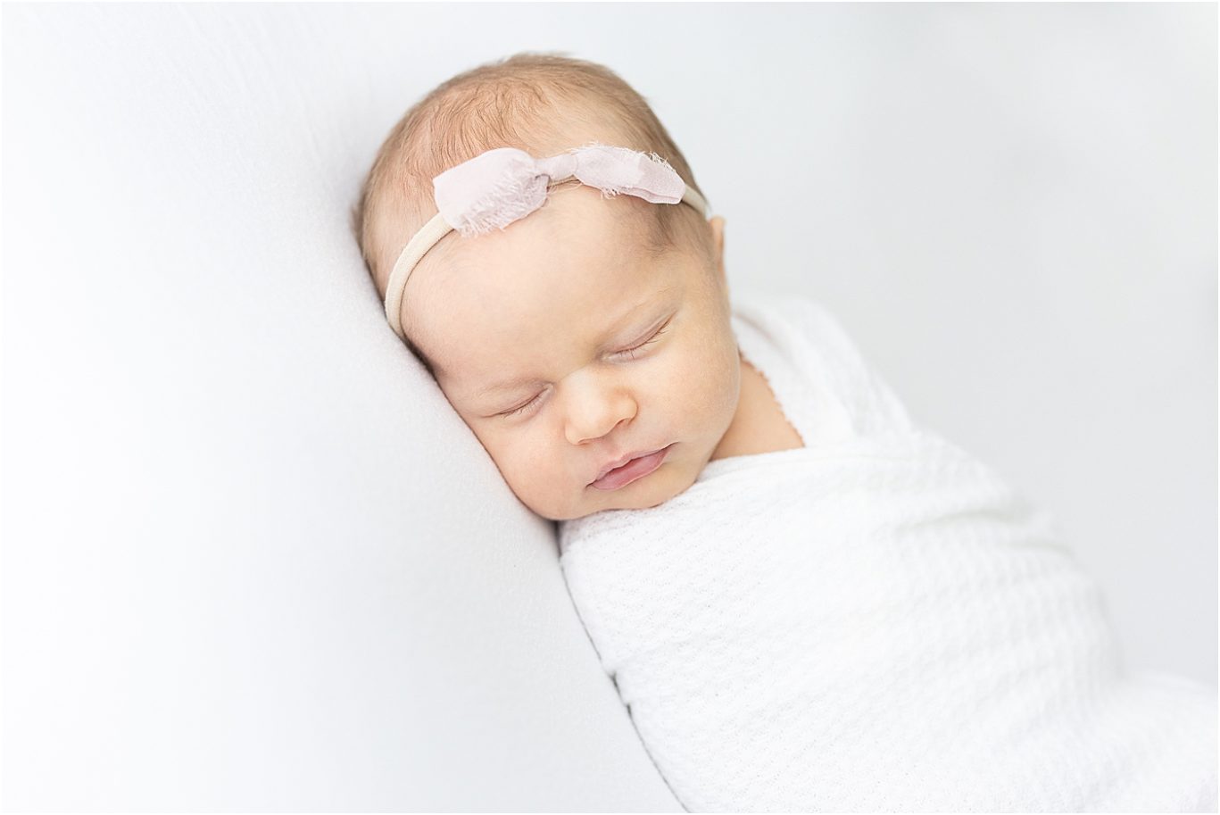 Newborn session with baby girl in studio in Fishers. Photo by Lindsay Konopa Photography.
