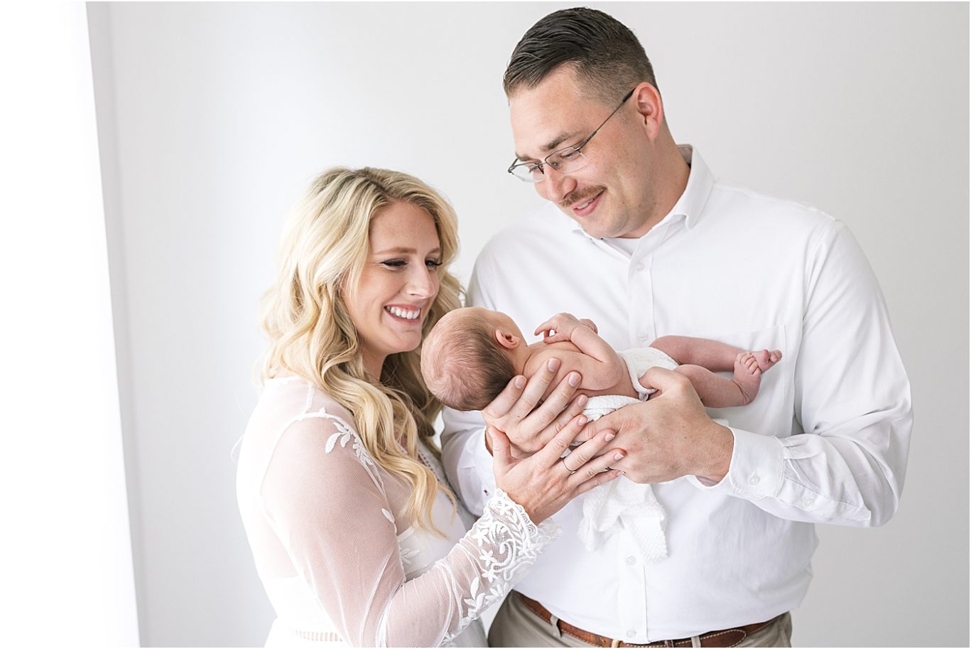 New parents holding their baby boy | Lindsay Konopa Photography