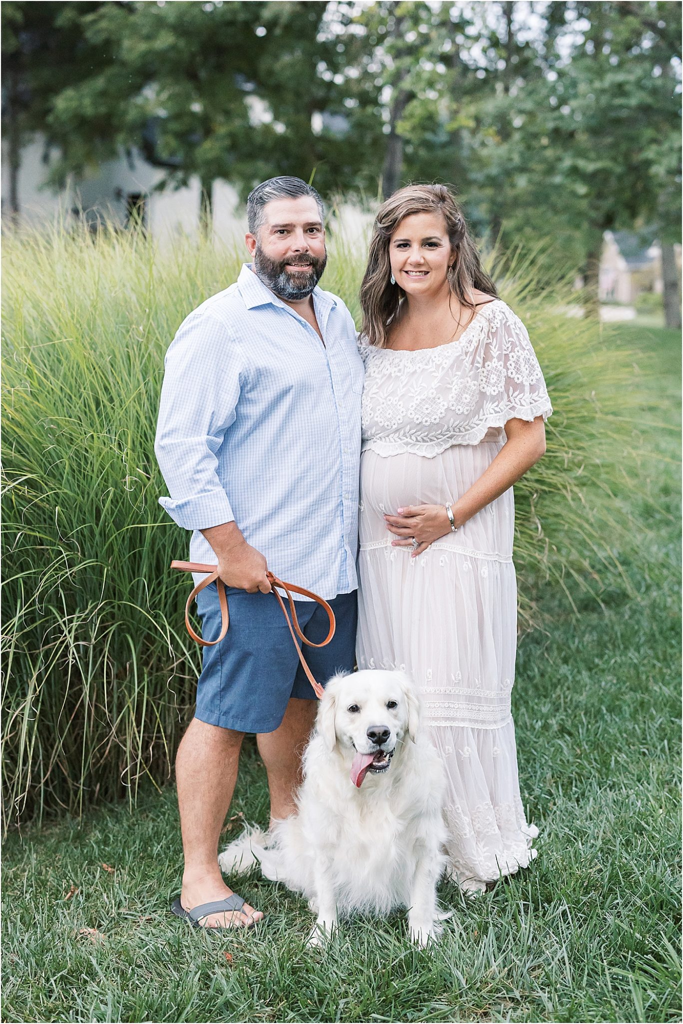Maternity photo of mom, dad, and dog.