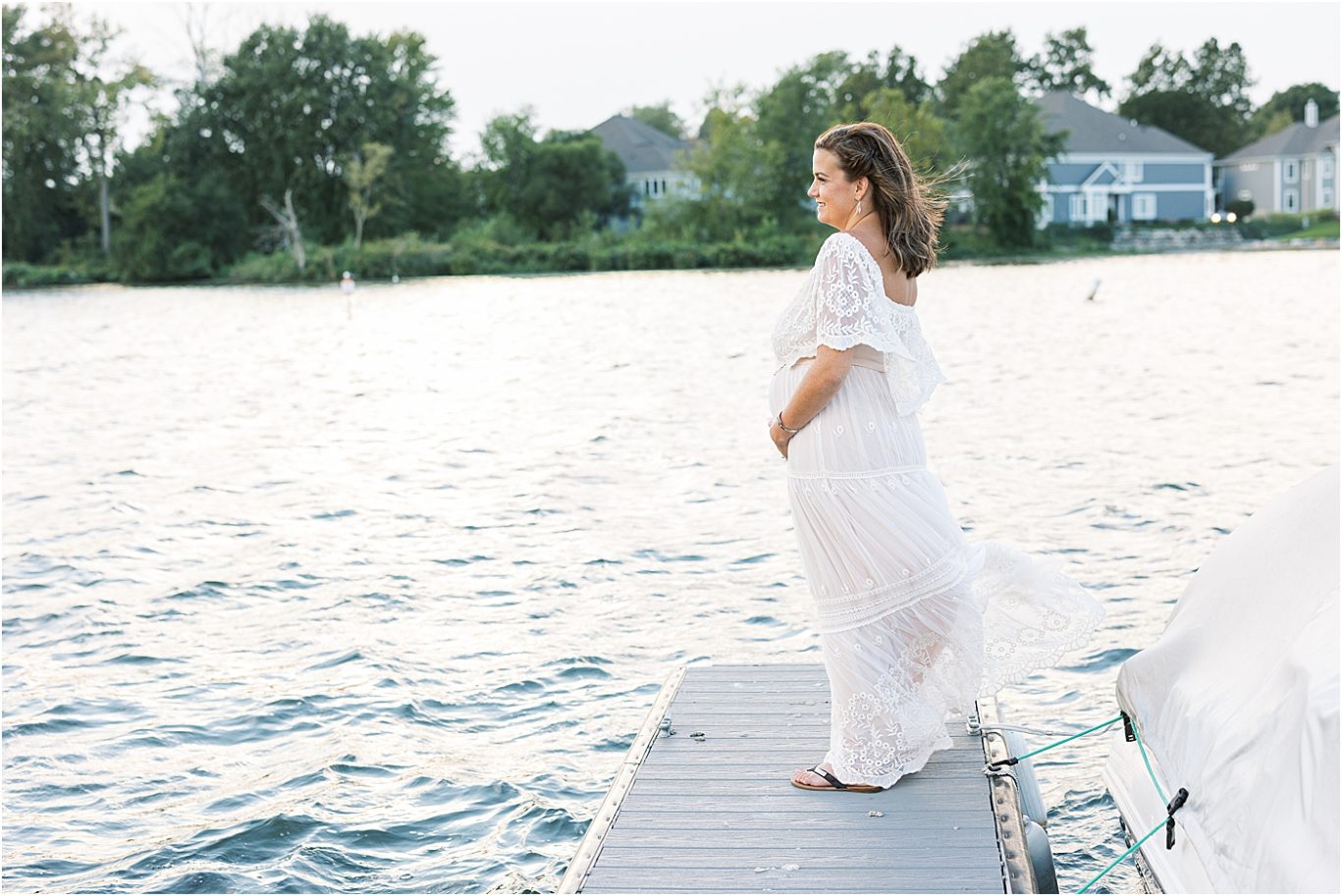 Expecting mom standing on dock at Geist Reservoir | Lindsay Konopa Photography