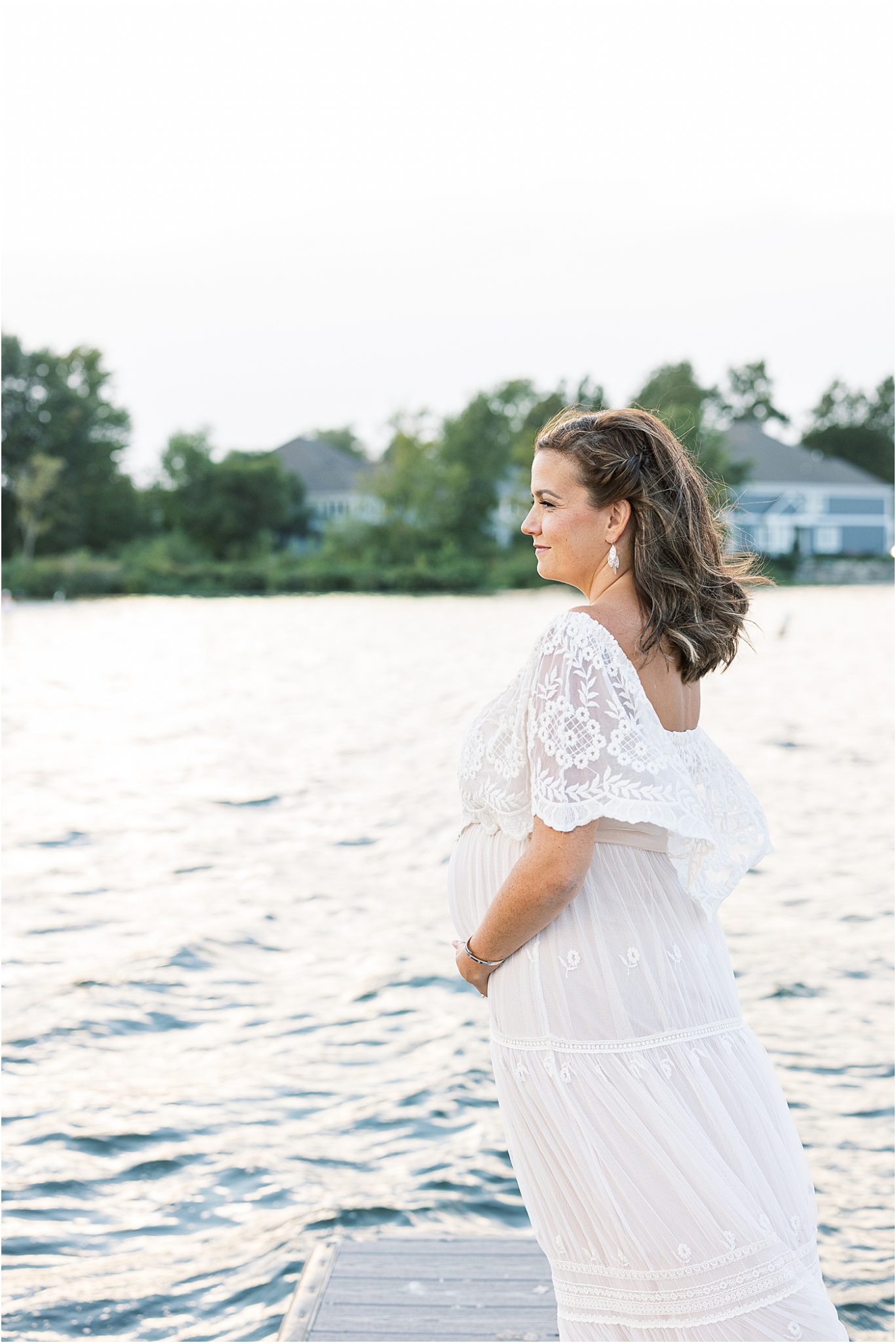 Expecting mom standing on dock at Geist Reservoir | Lindsay Konopa Photography