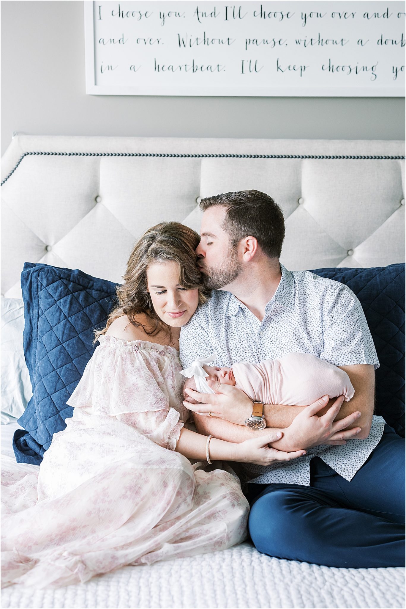 Parents holding their daughter during in-home newborn session with Lindsay Konopa Photography.