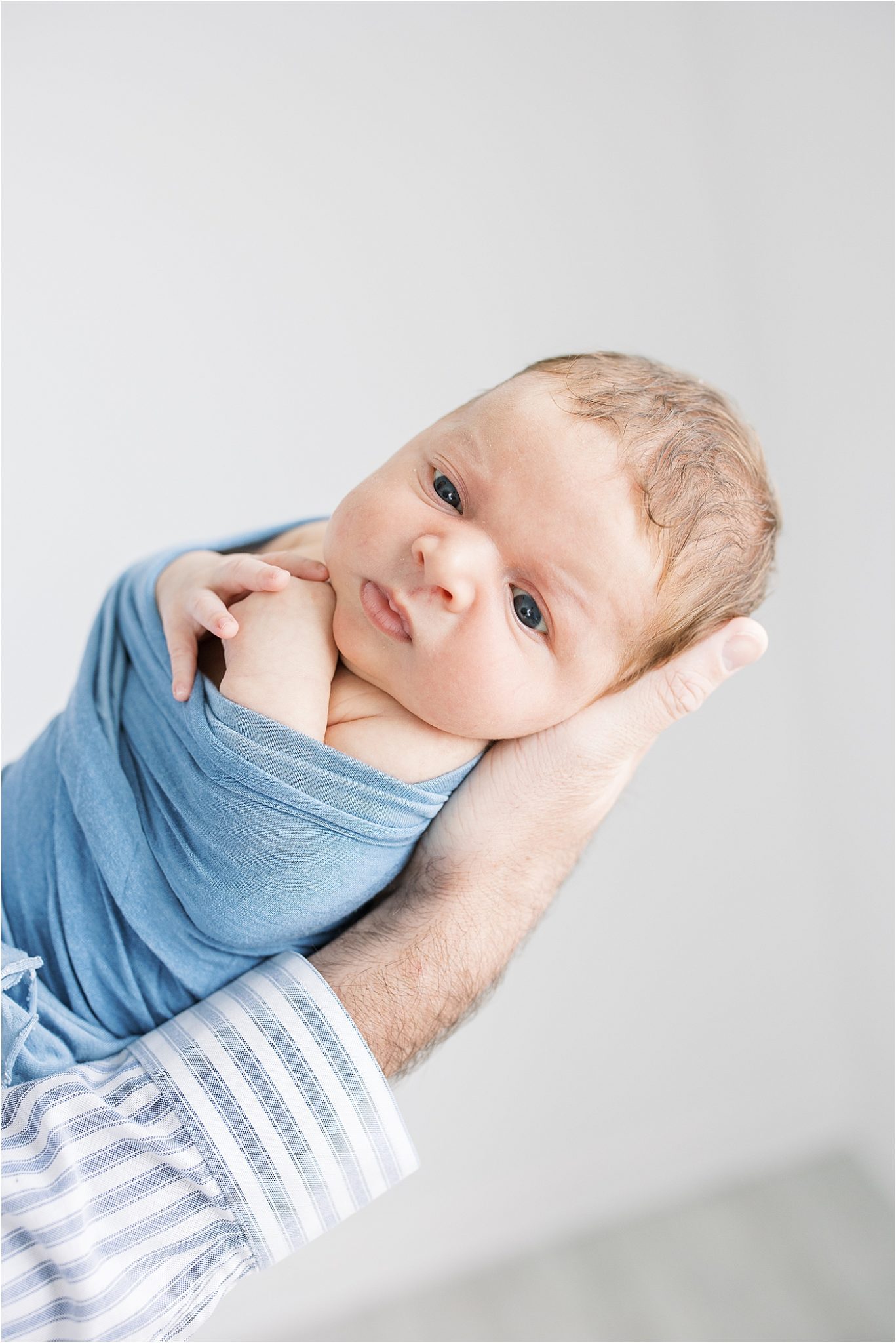 Baby boy in blue for newborn photos with Lindsay Konopa Photography.