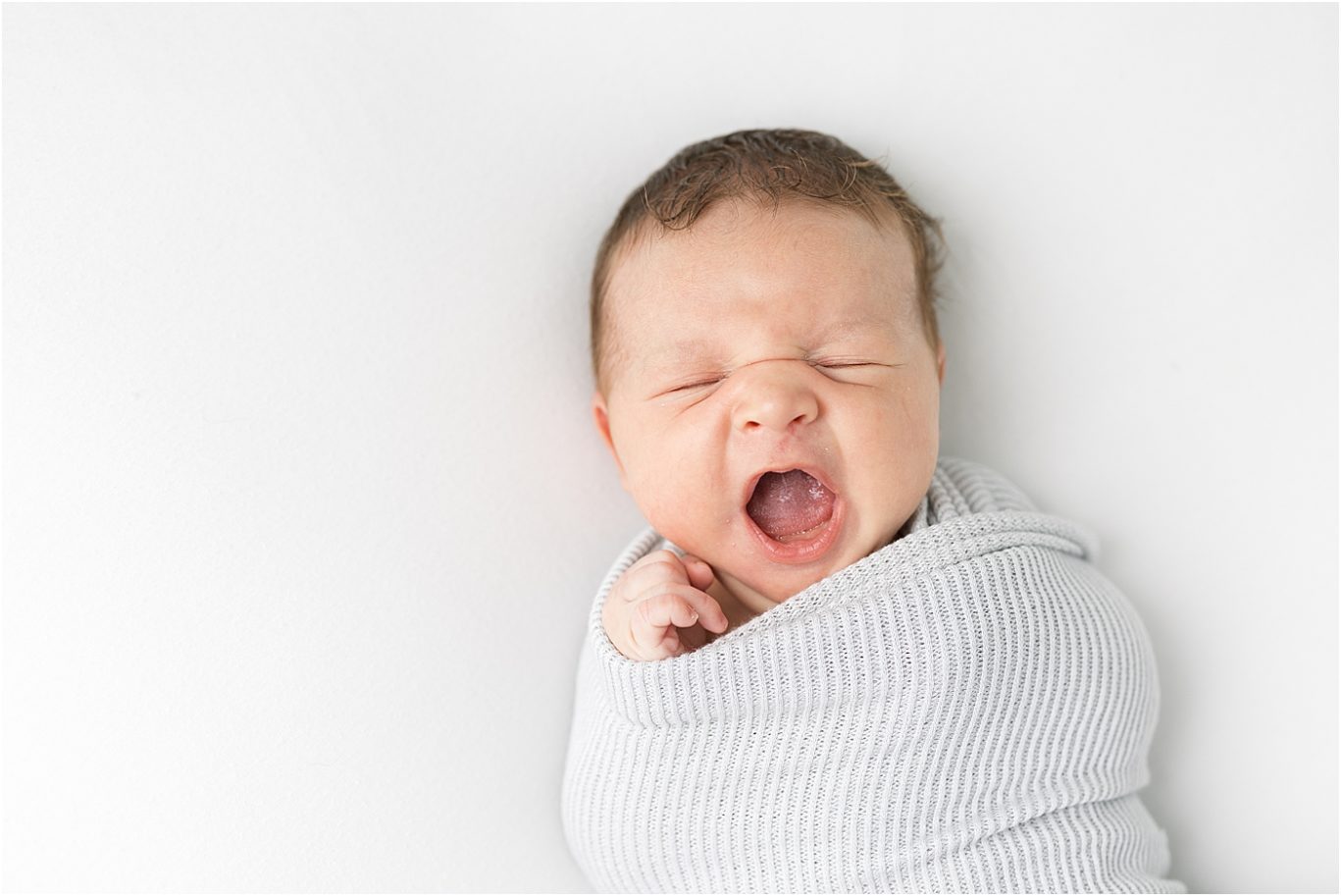 Baby boy yawning during newborn session | Lindsay Konopa Photography