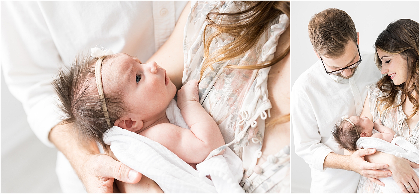 Baby girl looking up at her parents during newborn session with Lindsay Konopa Photography