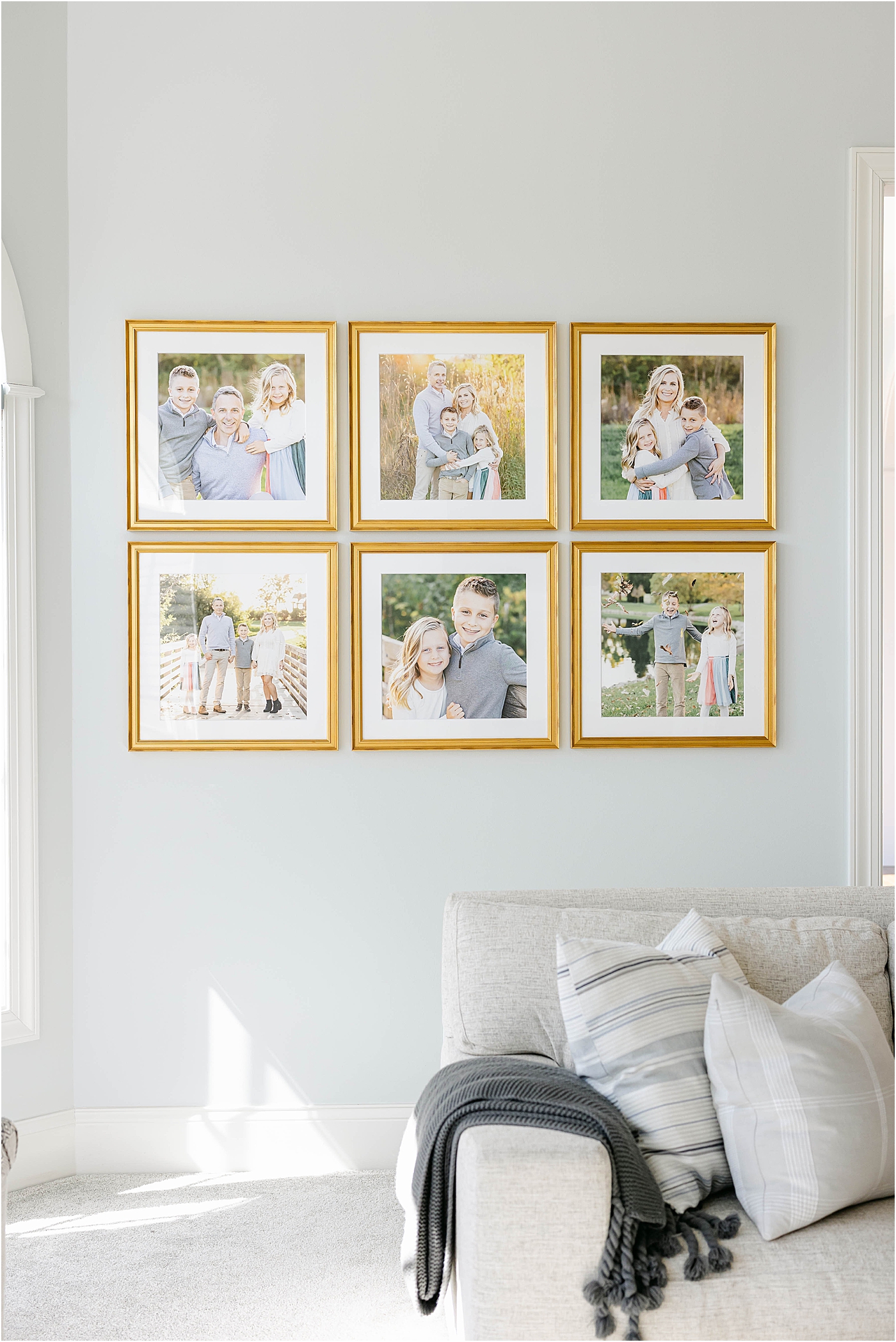 Custom-designed wall gallery of family portraits for living room | Lindsay Konopa Photography