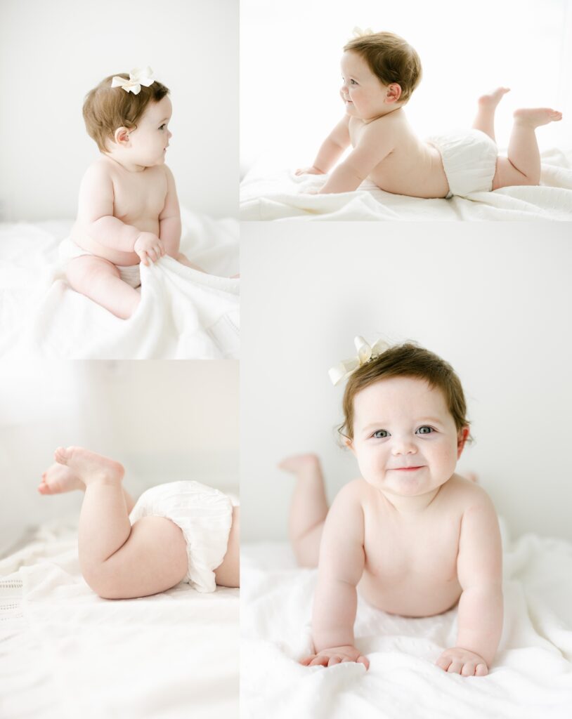Baby Photos | A 6 month milestone session with a brunette baby on a white blanket.
